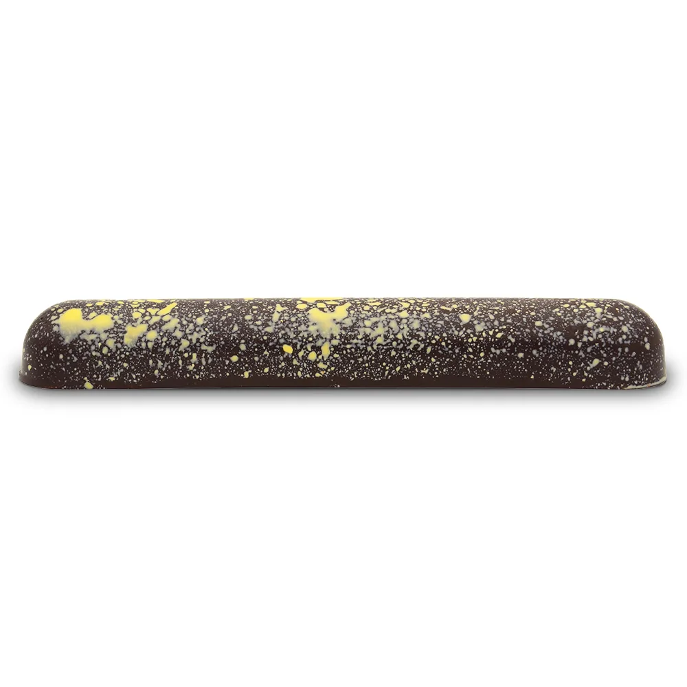 Una barra de bombón, con decoración "salpicaduras" en amarillo